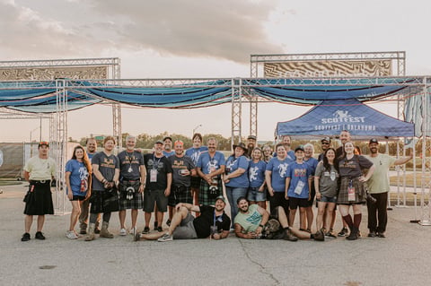 Group of happy volunteers who helped build a community event